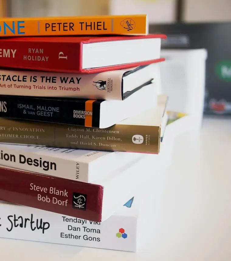 Pile of published books representing professional book publishing
