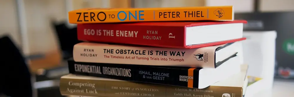 Pile of published books representing professional book publishing